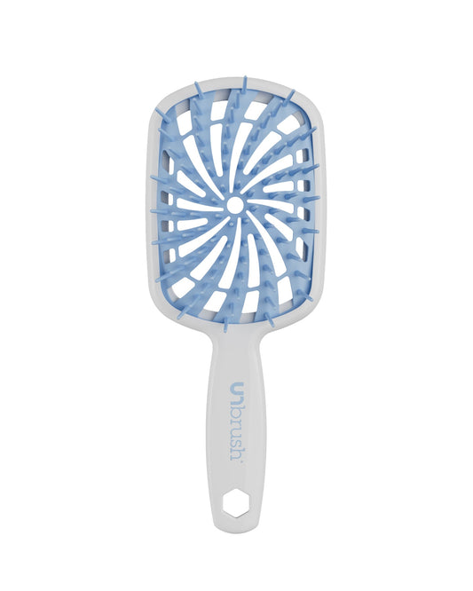 White Unbrush Plus detangling brush with blue spiral bristle pattern, designed for gentle use on wet or dry hair.