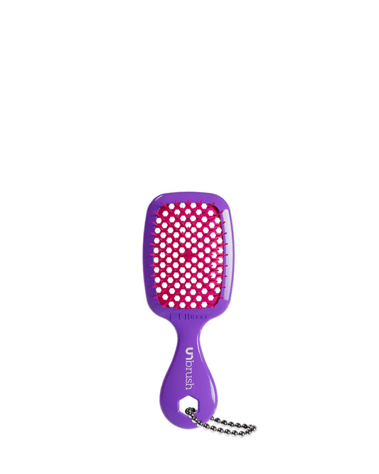 A hot purple UNbrush keychain with pink bristles, featuring a handle and chain